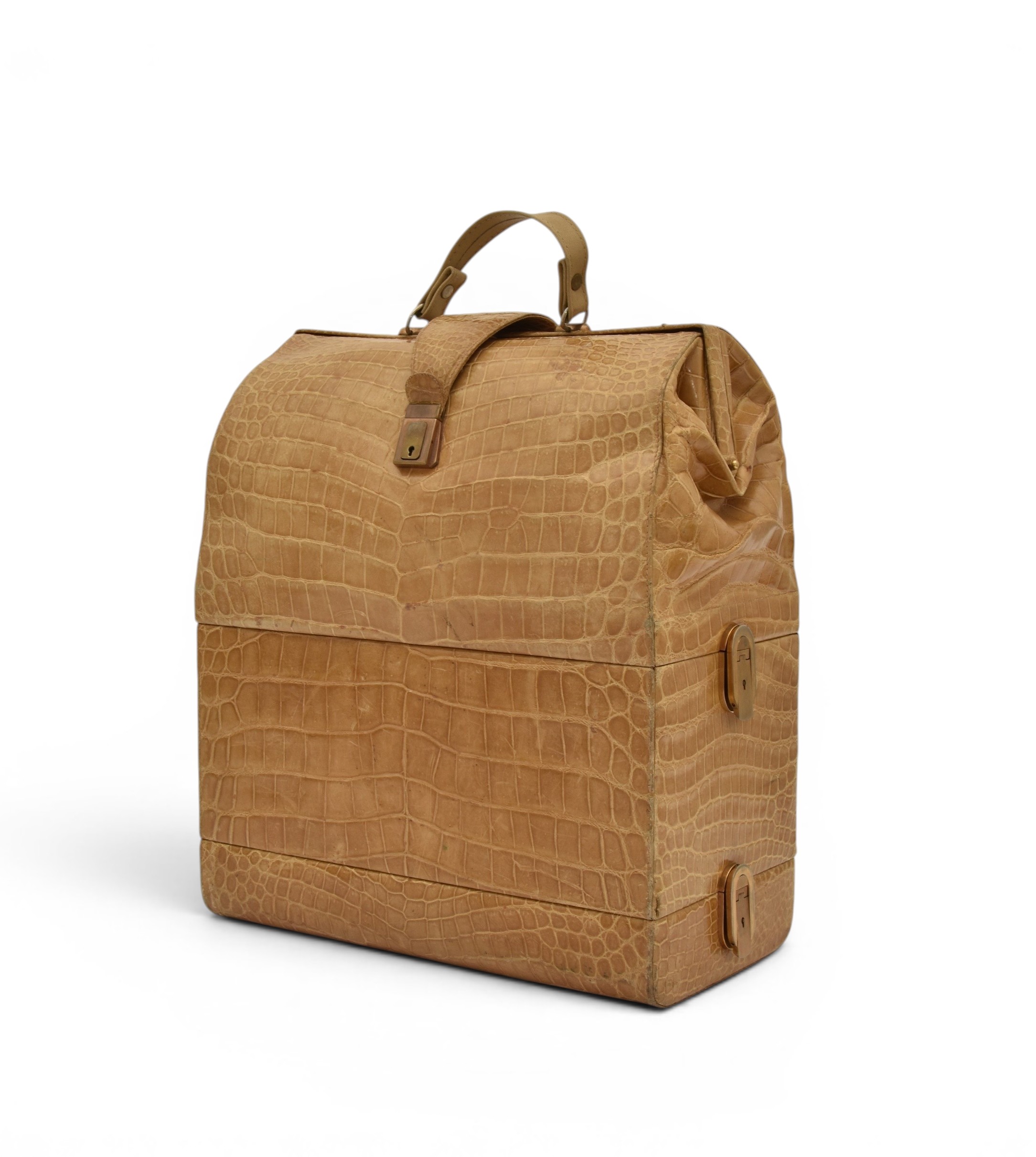 A light tan crocodile 'sac mallette' style travel bag, sold for £1,500 (+fees) at Halls in 2025